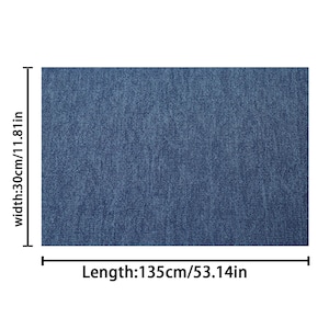 May include: A rectangular piece of blue denim fabric. The width is 30cm/11.81in and the length is 135cm/53.14in. The denim has a textured appearance.