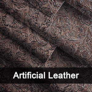 May include: Close-up of brown artificial leather with a floral embossed pattern. The material has a detailed, textured surface with a repeating design of flowers and leaves. The words "Artificial Leather" are displayed in white text.