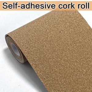 May include: A roll of self-adhesive cork material. The cork has a natural brown color and a textured surface. The roll is partially unrolled, revealing the cork's thickness and the white backing paper. The text "Self-adhesive cork roll" is at the top.