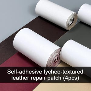 May include: Four rolls of self-adhesive lychee-textured leather repair patch material in dark brown, burgundy, dark grey, and beige. Each roll features a white paper backing and a distinct pebbled surface texture for repairing various leather items.