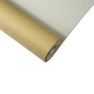 May include: A roll of brown kraft paper, with a lighter, off-white surface visible where the paper is unrolled. The paper is tightly wound, showing the layered edges of the roll. The background is plain white.