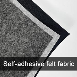 May include: Close-up of layered self-adhesive felt fabric in shades of gray and black. The text "Self-adhesive felt fabric" is displayed across the bottom of the image. The felt has a textured surface.