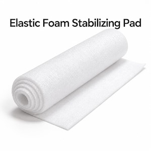 May include: A white, cylindrical roll of Elastic Foam Stabilising Pad. The material has a textured, porous surface and is partially unrolled, showing a flat, rectangular sheet extending from the main body of the roll against a plain background.
