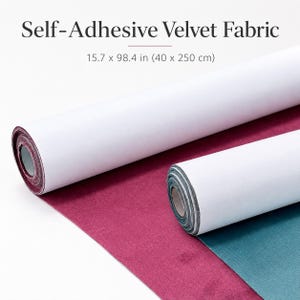 May include: Two rolls of self-adhesive velvet fabric, one in deep magenta and one in teal, each measuring 15.7 x 98.4 inches. The rolls feature a white paper backing that is partially peeled away to reveal the textured velvet surface underneath.