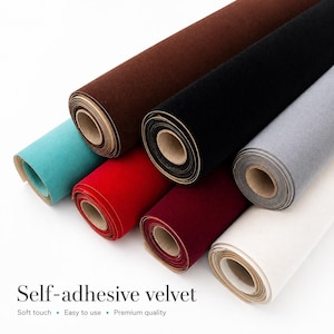 May include: A range of self-adhesive velvet rolls in colours such as brown, black, grey, red, and teal. The rolls are tightly wound, displaying the soft texture of the material. The text "Self-adhesive velvet" is visible at the bottom.