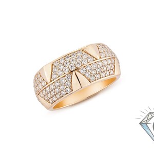 May include: A gold ring with a geometric design. The ring features rows of small, sparkling stones and triangular accents. The ring is set against a white background, highlighting its intricate details and craftsmanship.