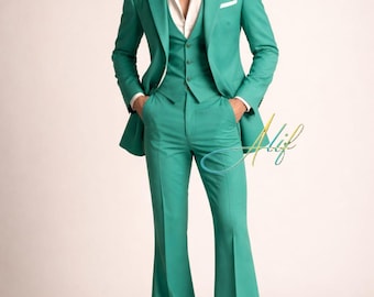 May include: A three-piece teal suit with a white collared shirt. The suit includes a blazer, waistcoat, and flared trousers. The outfit is completed with white shoes. The suit is a retro style.