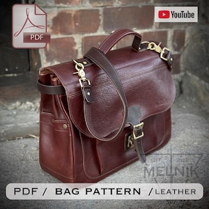 May include: A burgundy leather bag with a top handle and adjustable shoulder strap. The bag features gold-colored hardware, including clasps and buckles. The image includes the text "PDF / BAG PATTERN / LEATHER".