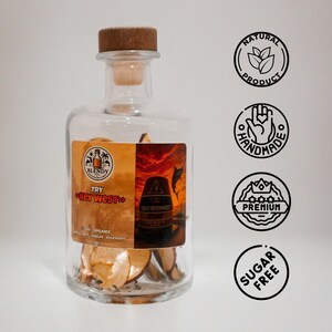 May include: A clear glass bottle with a wooden stopper, filled with dried fruit. The label reads "Blendy Try Key West" and "Southernmost". The bottle is accompanied by four circular icons: "Natural Product", "Handmade", "Premium", and "Sugar Free".