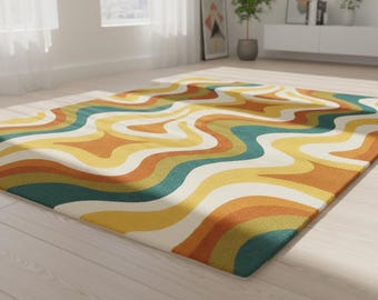 May include: A rectangular area rug with a retro design. The rug features a wavy pattern in shades of yellow, orange, teal, and white. The rug is placed on a light-colored wooden floor in a well-lit room.