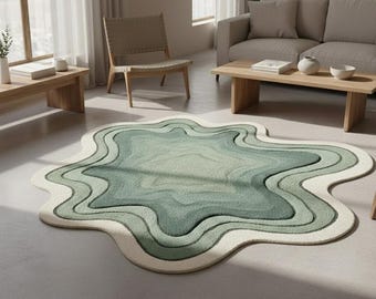 May include: A unique, abstract rug with a layered design in shades of green and white. The rug has a wavy, organic shape, adding a modern touch to the room. The rug's design resembles a topographical map or a stylized landscape.