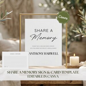 May include: A white sign with the words "SHARE A Memory" in elegant black script, framed in gold. A matching card is placed in front. A lit candle and greenery are in the background. The sign is a template, editable in Canva.