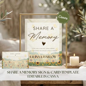 May include: A framed sign and matching cards with the text "Share a Memory". The sign has a floral design with sunflowers and butterflies. The text "Share a Memory" is in elegant script. The sign is in a gold frame.