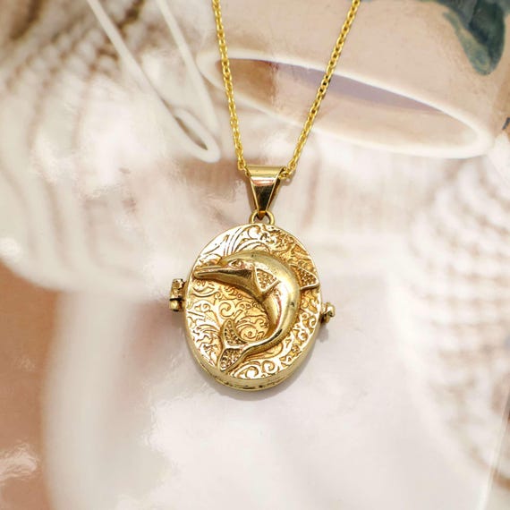 A handcrafted brass 'poison box' pendant with a hidden keepsake compartment — equal parts Victorian apothecary mystique and wearable curiosity cabinet.