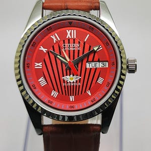 Refurbished Citizen Automatic 21 Jewels Men's Watch Red Dial Black Stripe Pattern Roman Numeral Markers Day Date Brown Leather Band