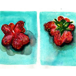 May include: Two watercolor paintings of strawberries on a turquoise background. The strawberries are red with yellow seeds and have a green stem and leaves. One strawberry is whole and the other is cut in half.