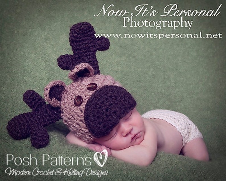 May include: A baby wearing a crocheted reindeer hat with brown antlers and a white crocheted diaper. The baby is sleeping on a green blanket. The image includes the text "Now It's Personal Photography" and "www.nowitspersonal.net".