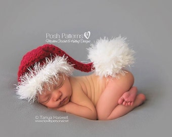 Könnte beinhalten: Ein Neugeborenes trägt eine rot-weiße gehäkelte Weihnachtsmütze mit einem weißen Bommel. Das Baby schläft auf einem grauen Hintergrund. © Tanya Haswell www.nowitsersonal.net