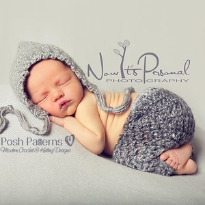 May include: A newborn baby wearing a gray crocheted hat and matching pants. The baby is sleeping peacefully on a gray blanket. The image includes the text "Now It's Personal Photography" and "Posh Patterns Modern Crochet & Knitting Designs".