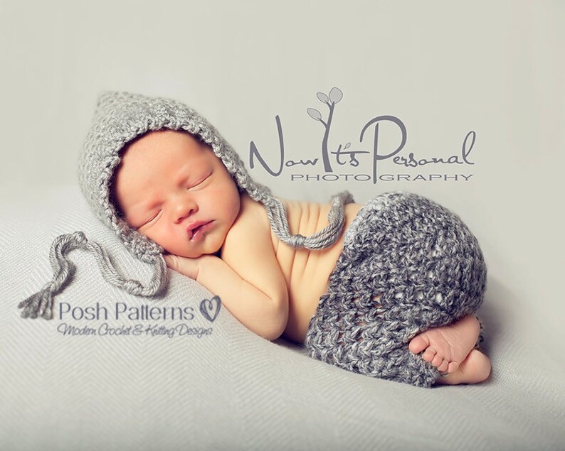 May include: A newborn baby wearing a gray crocheted hat and matching pants. The baby is sleeping peacefully on a gray blanket. The image includes the text "Now It's Personal Photography" and "Posh Patterns Modern Crochet & Knitting Designs".