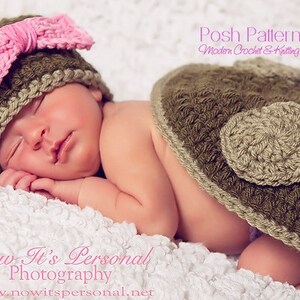 May include: A sleeping baby wearing a crocheted hat with a pink bow and a crocheted skirt with a brown heart design. The text "Posh Patterns Modern Crochet & Knitting Designs" is visible in the top right corner of the image.