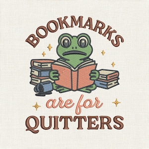 May include: Embroidered design featuring a green frog reading a book, with the text "BOOKMARKS are for QUITTERS." The frog is surrounded by stacks of books and a blue mug. The design includes gold star accents.