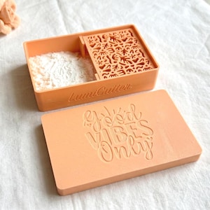 May include: A set of three ceramic mugs with a speckled, matte finish. The mugs are in shades of cream, light gray, and dark gray. Each mug has a simple, minimalist design, perfect for coffee or tea.