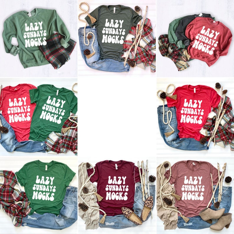 May include: Nine different t-shirts featuring the text "Lazy Sundays Mocs" in a retro font. The shirts are in a variety of colours, including red, green, maroon, and pink. The shirts are laid out on a white surface with various props, such as jeans, scarves, and pinecones.