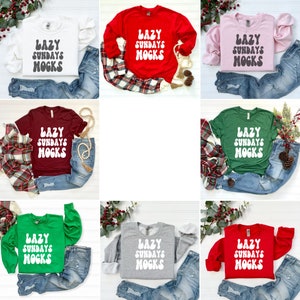 May include: Nine different colour variations of a long-sleeved shirt with the text "LAZY SUNDAYS MOGKS" in a retro font.