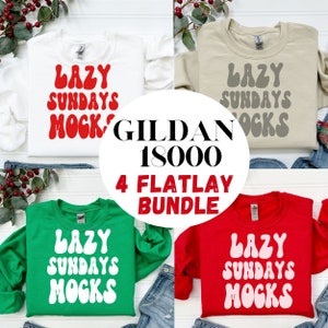 May include: Four Gildan 18000 sweatshirts with the text "Lazy Sundays" in a retro font. The sweatshirts are in white, beige, green, and red.