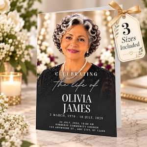 Op de afbeelding: Een uitvaartprogramma kaart met een portret van een vrouw met donker krullend haar en een witte parelketting. De tekst luidt CELEBRATING the life of OLIVIA JAMES, 5 MARCH, 1970 - 18 JULY, 2029, en details. Een gouden label vermeldt 3 Sizes Included.