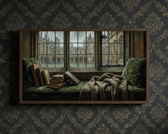 May include: A framed painting depicts a cozy reading nook with a view of a historic building through a window. The scene includes a green velvet cushion, books, and a blanket. The artwork is set against a dark, patterned wallpaper.