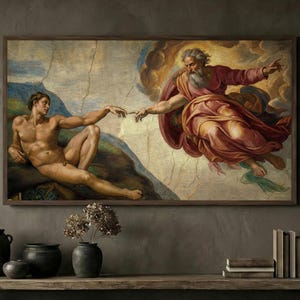 May include: A framed print of Michelangelo's "The Creation of Adam". The artwork depicts two figures, one nude, reaching towards each other. The print is in a dark wooden frame, displayed above a wooden table with decorative vases and books.