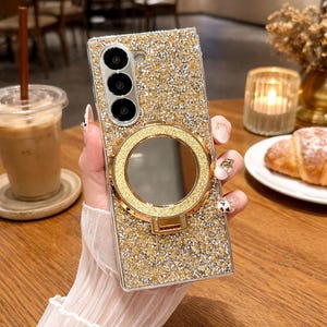 May include: A white ceramic mug with a black handle and the text "But First, Coffee" in a bold, black font. The mug is likely 11 ounces in size and sits on a white surface.