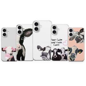 Peut inclure: Cinq coques de téléphone avec des illustrations de vaches. Les motifs incluent des vaches avec des bulles de chewing-gum et l'inscription « Keep Calm and Love Cows ».