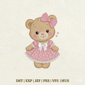 May include: An embroidery design of a light brown teddy bear wearing a pink dress with white polka dots, a white bow at the waist, and a matching pink bow on its head. Two small pink hearts are visible to the right. Text reads: DST | EXP | JEF | PES | VP3 | HUS
