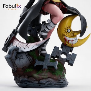 May include: A detailed anime-style figurine featuring a character in a black coat and red plaid skirt, standing on a base with a large scythe, a yellow crescent moon with a face, and stone-like cross structures with green mossy accents.