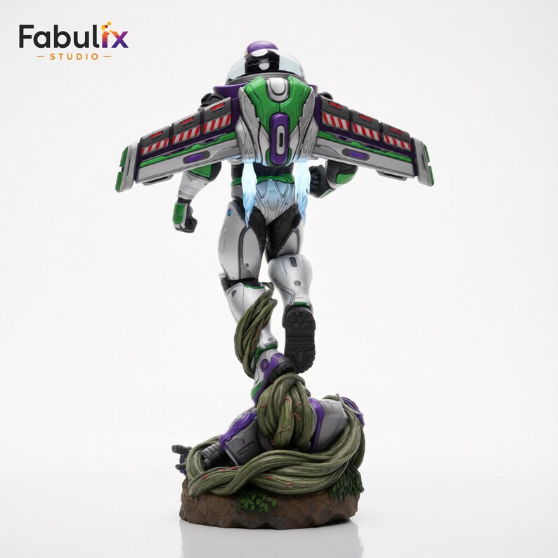 May include: A detailed figurine of Buzz Lightyear in a dynamic pose, viewed from the back. The figure features a silver, green, and purple color scheme with outstretched wings. The base is a detailed, earthy design with vines.