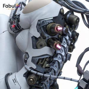 May include: A robotic torso featuring a white textured shell with exposed mechanical components in dark metallic gray and bronze. Two cylindrical ports emit a glowing pink light. Cables extend from the structure, and the text Fabulix Studio is visible.