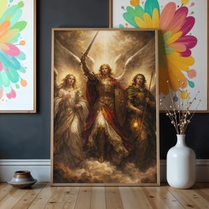 May include: A framed print showcases three angelic figures with large wings, set against a celestial background. The central figure, in golden armour and a red cape, raises a sword. The other figures wear flowing gowns. The artwork is displayed on a wooden floor.