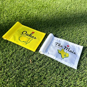 May include: A set of three ceramic mugs with a speckled, matte finish. The mugs are in shades of cream, light gray, and dark gray. Each mug has a simple, minimalist design, perfect for coffee or tea.