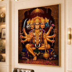 May include: A framed wall art print depicting the Hindu deity Panchamukhi Hanuman with five faces and multiple arms, seated in a meditative pose. The figure is adorned in gold jewelry and colorful garments, holding various symbolic items against a dark background.