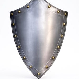 May include: A heater-style shield made of polished steel with a smooth, curved surface. The perimeter features a raised border accented with evenly spaced, rounded brass-coloured metal rivets that follow the pointed shape of the shield.