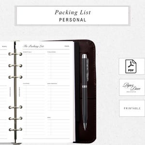 May include: A personal packing list planner with a dark brown leather cover, open to a blank page with sections for essentials, toiletries, clothes, electronics, and misc. A black pen rests on the right side. The top of the page reads "Packing List PERSONAL".