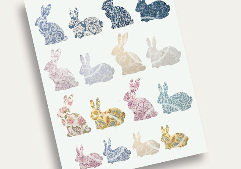 May include: A sheet of paper with 15 bunny silhouettes, each filled with a different floral pattern. The bunnies are arranged in a grid pattern, with three rows of five bunnies each. The patterns are in shades of blue, pink, yellow, and white.