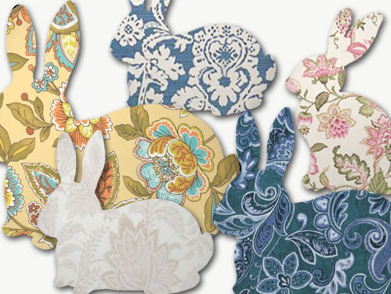 May include: Five fabric bunny shapes in various floral and paisley patterns. The bunnies are in shades of blue, yellow, pink, and white.