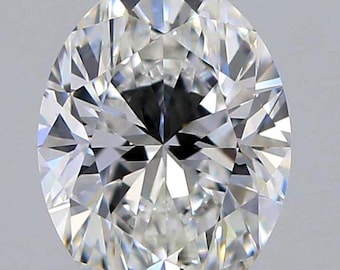 May include: A brilliant, oval-cut diamond with numerous facets, reflecting light. The gemstone is colorless and appears to be set against a neutral background. The cut of the diamond maximizes its sparkle and brilliance.