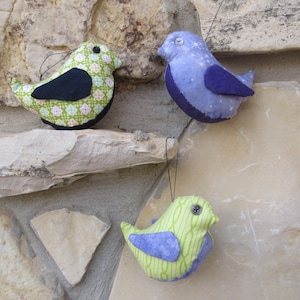 May include: A white ceramic mug with a black handle and the text "But First, Coffee" in a handwritten style. The mug is on a white surface. The mug is approximately 4 inches tall.