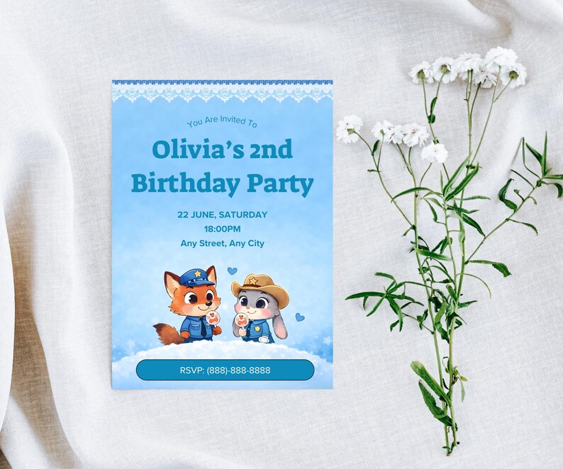 May include: A light blue birthday party invitation with the text "Olivia's 2nd Birthday Party". The invitation features cartoon characters and the RSVP phone number. White flowers are in the background.