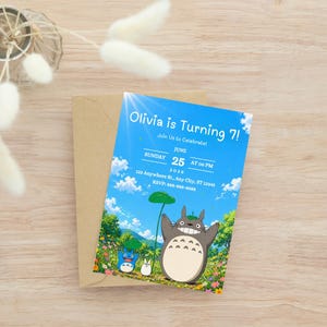 May include: A birthday invitation featuring a blue sky background with cartoon characters. The invitation reads "Olivia is Turning 7!" with the date, time, and RSVP information. The invitation is on a brown envelope.